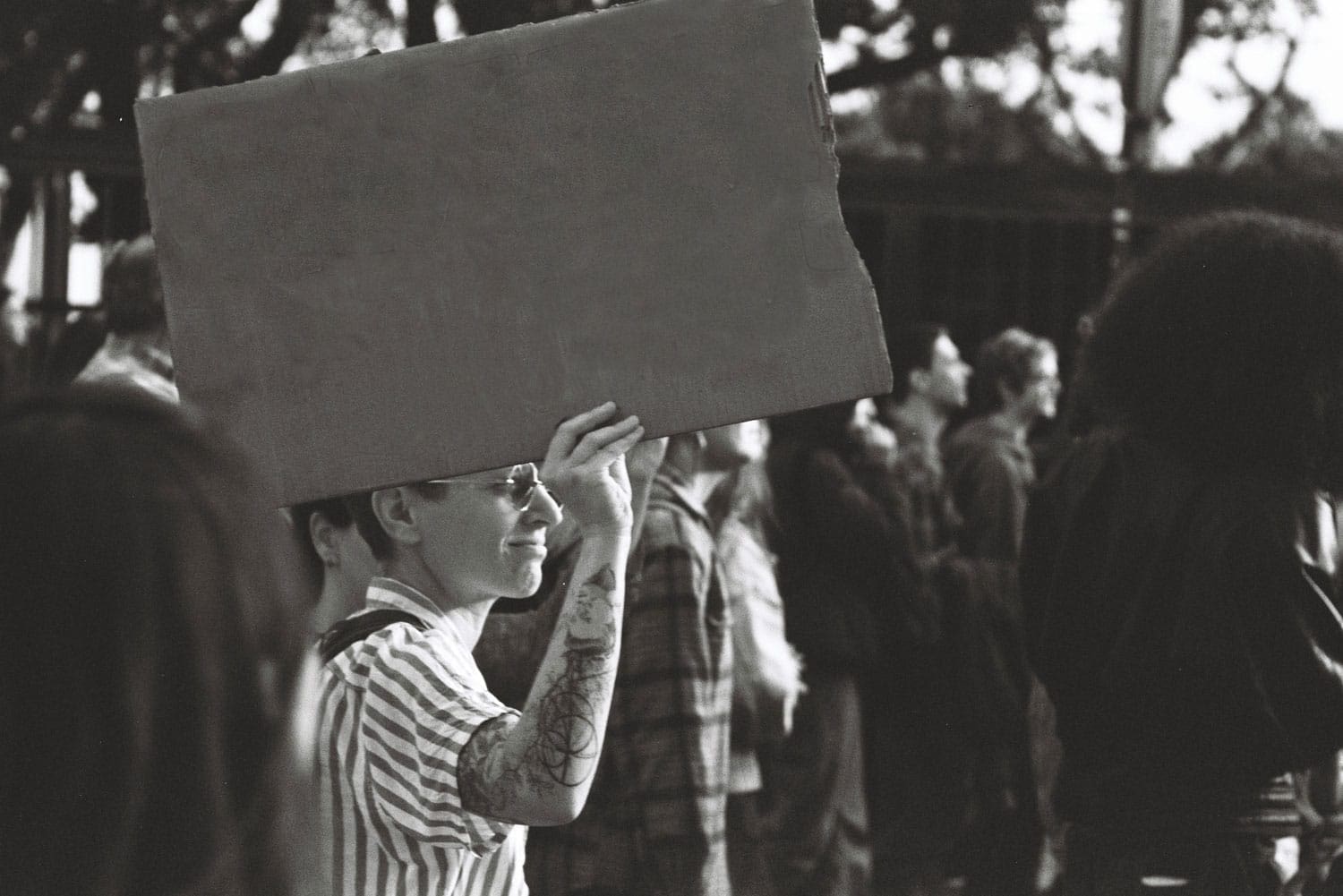 cloud-connex-man-in-crowd-holding-sign