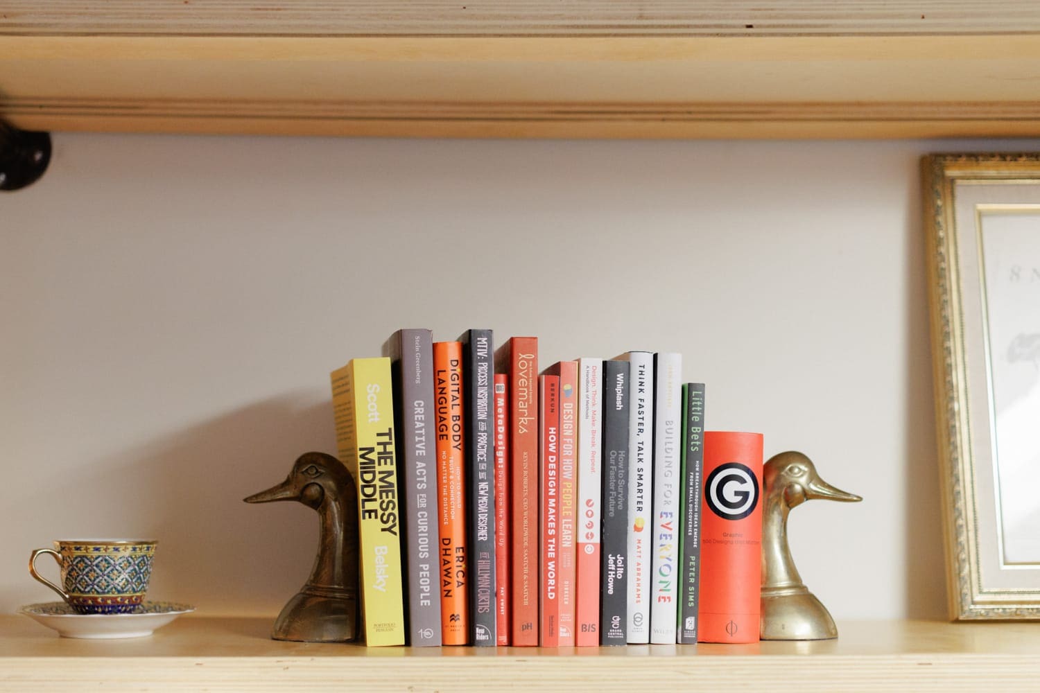 Bookshelf in the CloudConnex office featuring creative and business strategy books for team inspiration