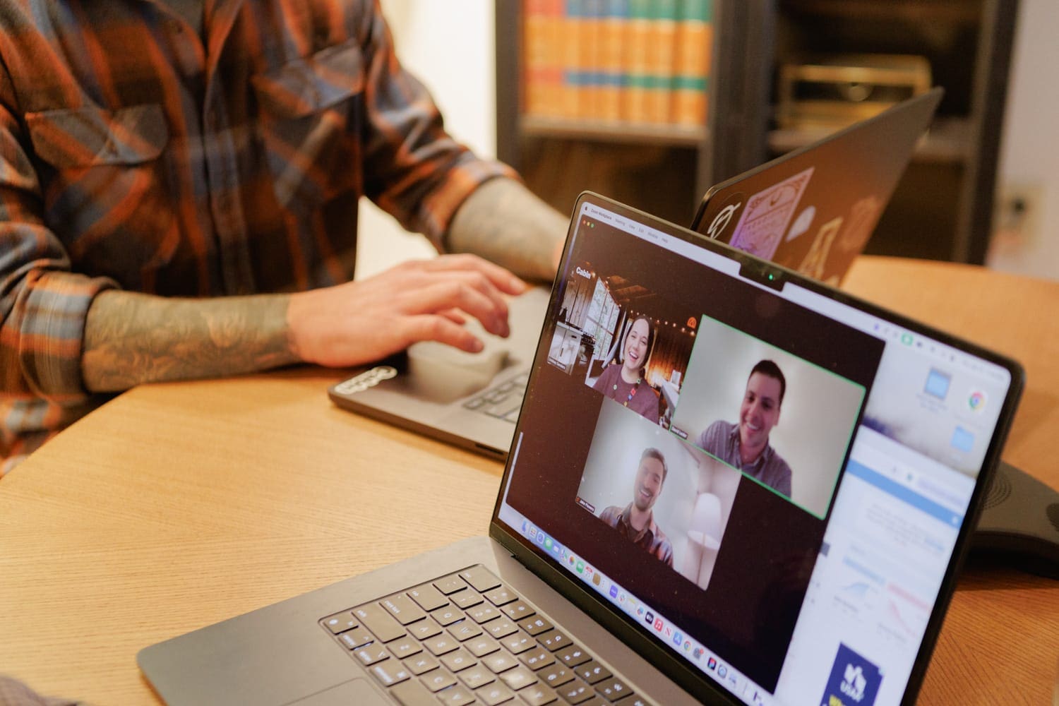 Laptop screen showing an active Zoom video call during remote work session at Cloud Connex